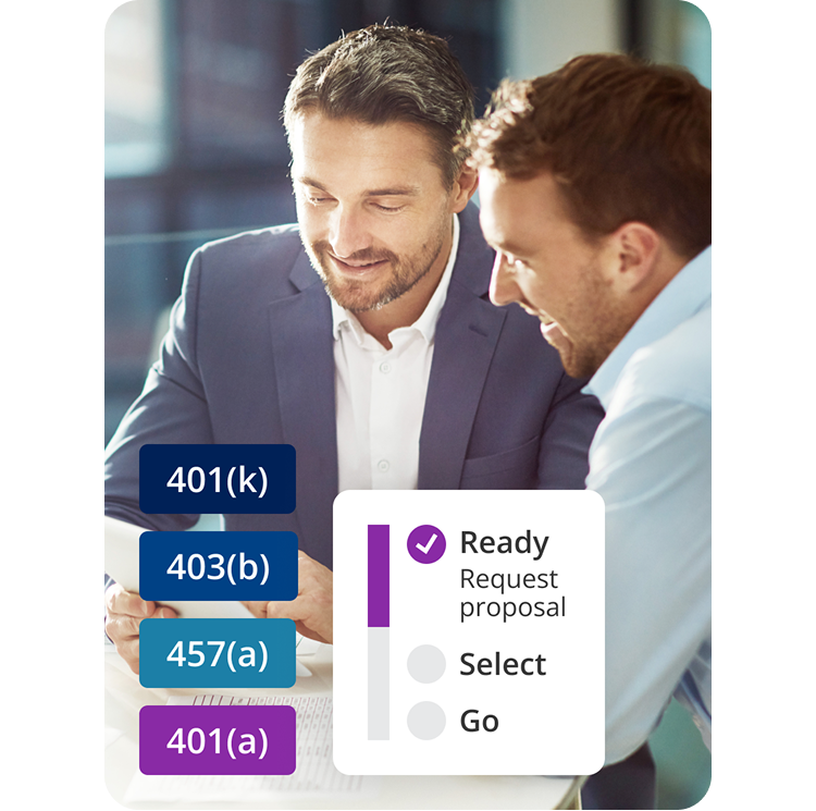Two men sit at a desk reviewing financial documents. Ready. Select. Go. 